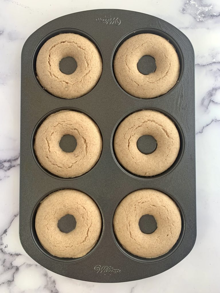 Cooked donuts still in the pan