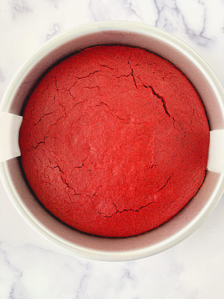 Baked red velvet cake layer, still in pan
