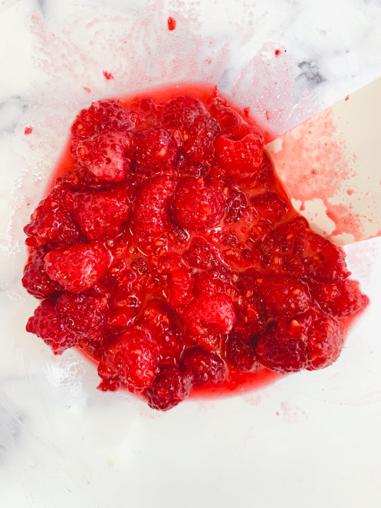 Fresh raspberry mixture in a glass bowl