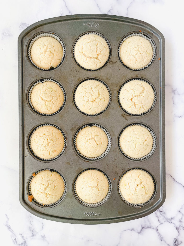 Batter for vegan coconut lime cupcakes baked but still in the muffin tin