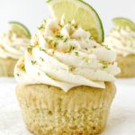 Vegan Coconut Lime Cupcakes one close up cupcake topped with a frosting swirl and lime wedge