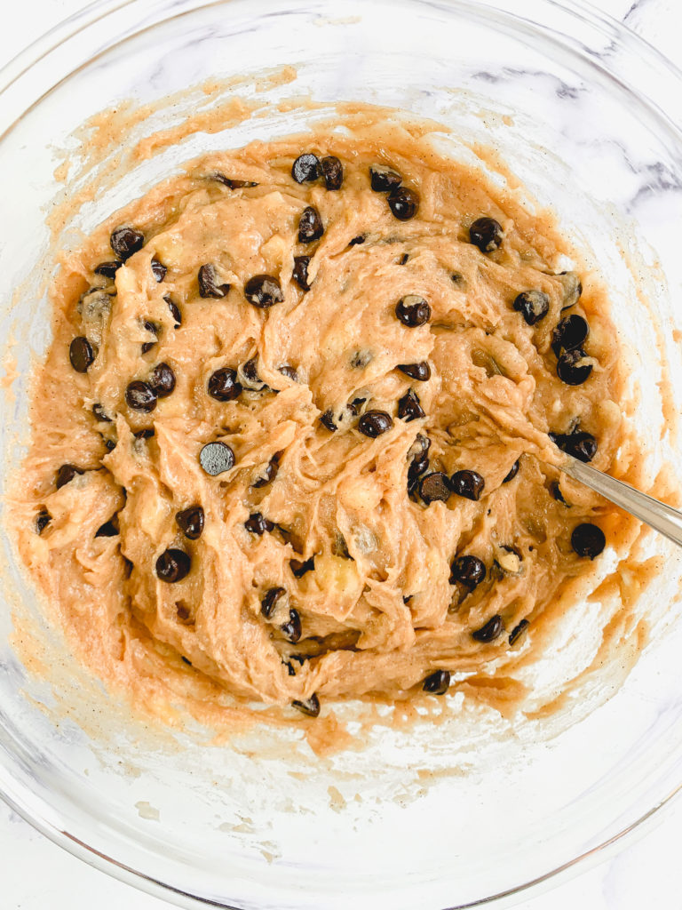 Fully combined batter in a glass bowl, including chocolate chips