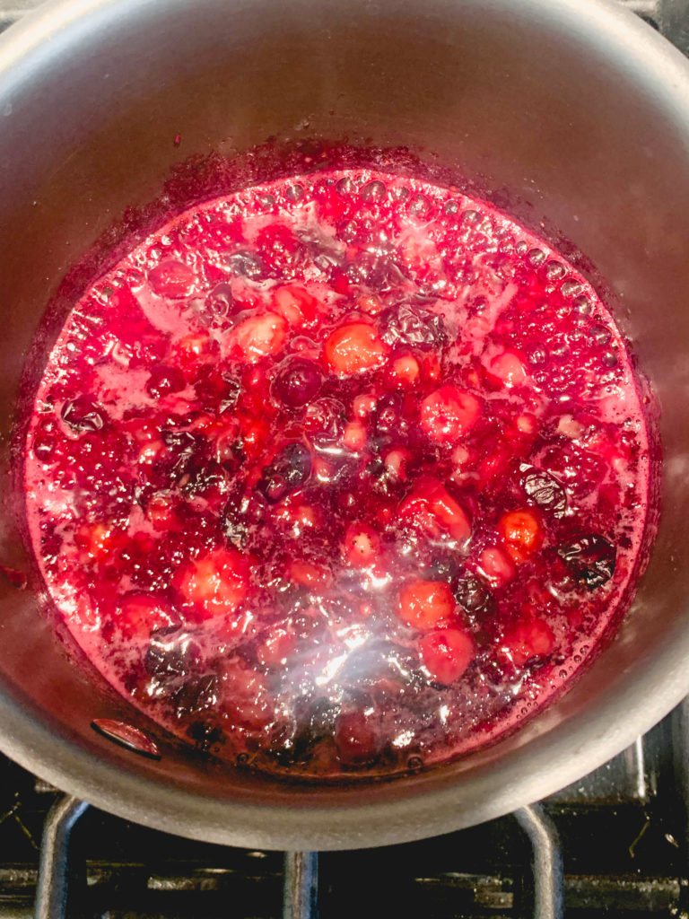 Simmering blueberries in a pot