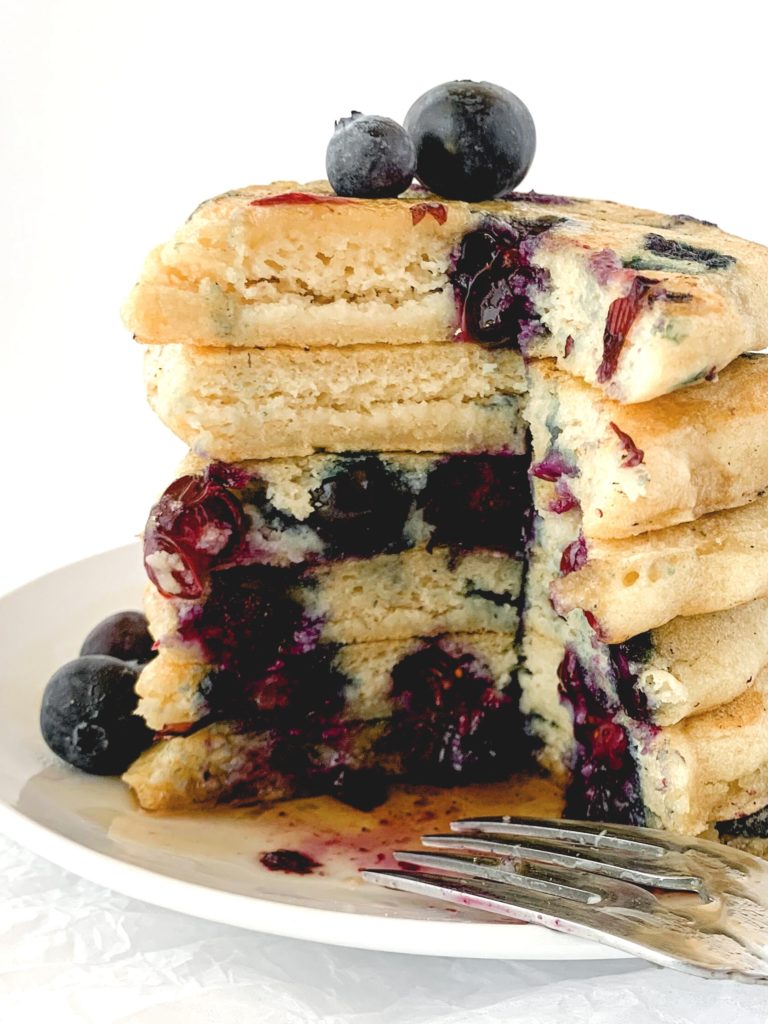 Stack of pancakes cut into to see the fluffy insides