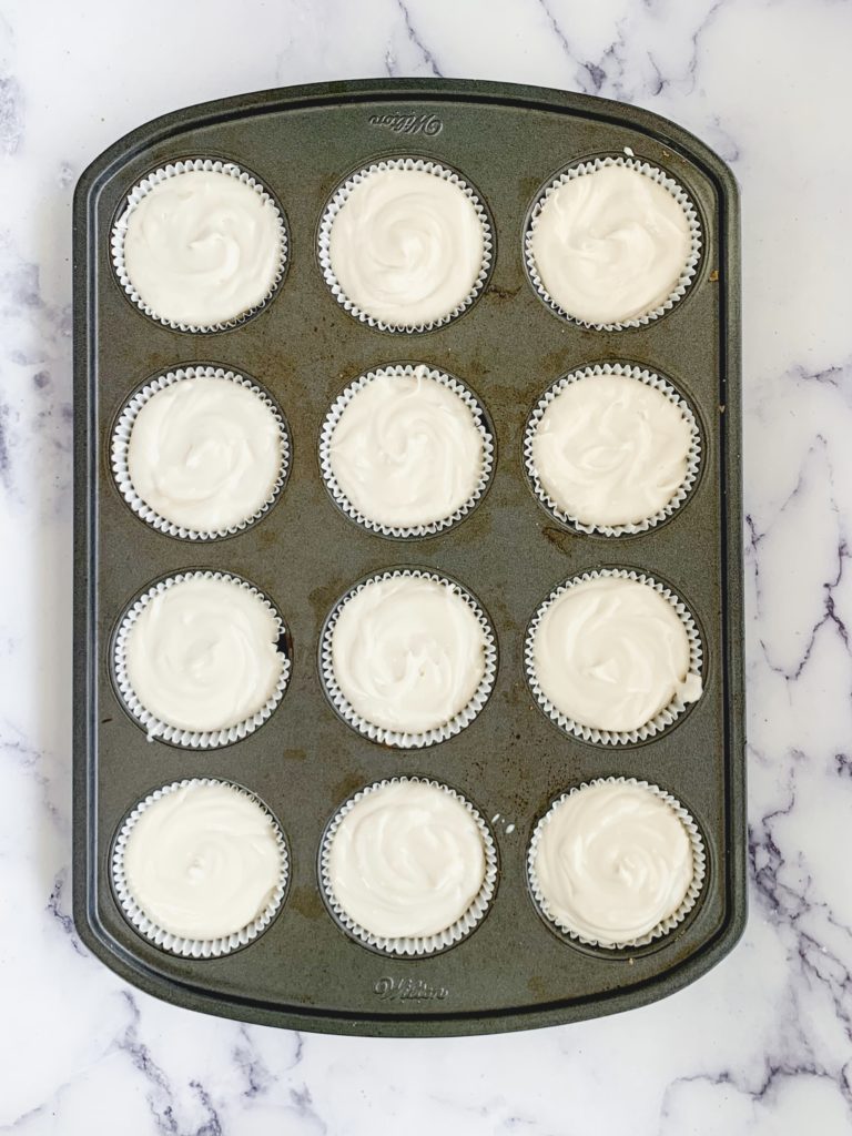Cheesecake batter in the muffin tin, unbaked
