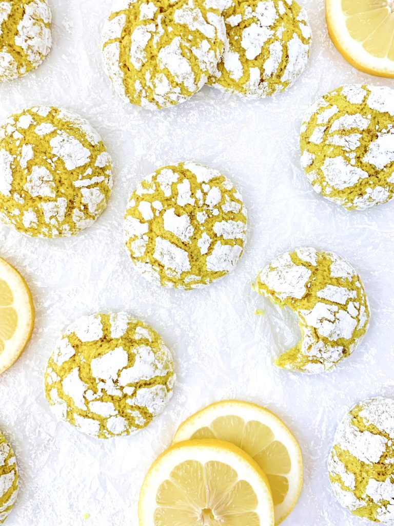 A bunch of cookies on a white background, also some lemon slices
